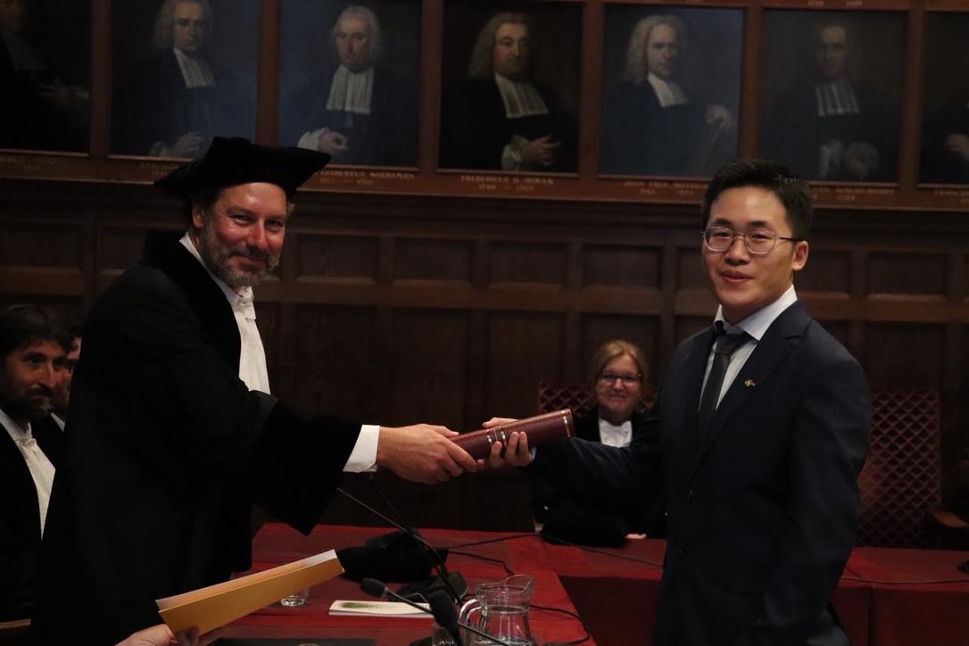 Xiaobin Pan receiving his doctoral degree after successfully defending his PhD at Utrecht University