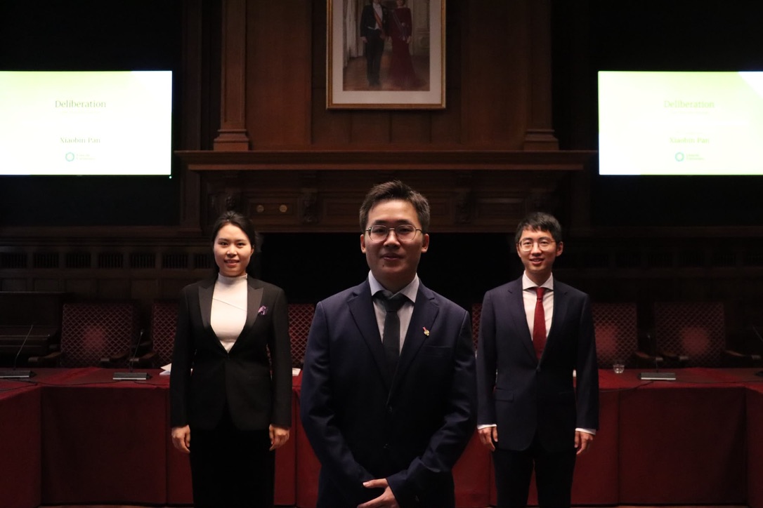 Xiaobin Pan with two friends in the PhD defense hall